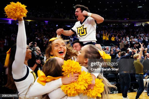 Marquette Golden Eagles cheerleaders react after the Golden Eagles score in the final seconds of the second half against the Villanova Wildcats...