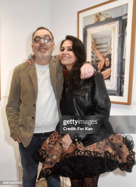 Photographer Gerard Harten and actress Catherine Wilkening attend "Portraits Croisés" Gerard Harten’s Photo Exhibition Preview at Galerie Roanne de...