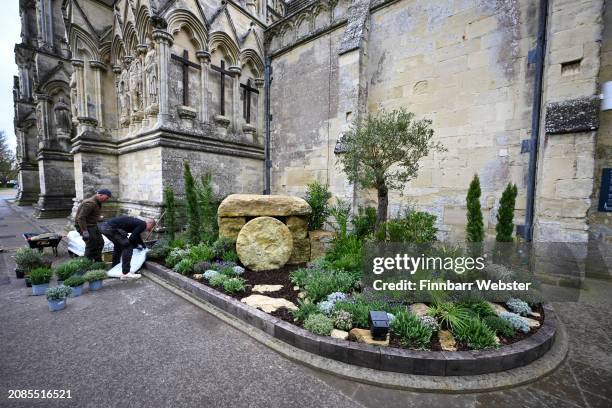 Andy McIndoe and his assistant Billy Moss, put the final touches to the Easter Garden installation at Salisbury Cathedral on March 14, 2024 in...