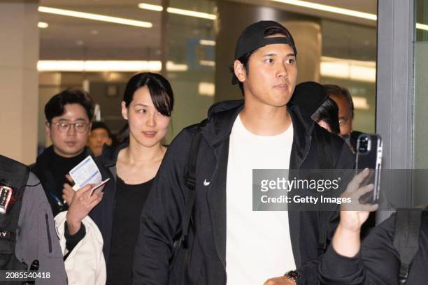 Shohei Ohtani of the Los Angeles Dodgers and his wife Mamiko Tanaka are seen on arrival at Incheon International Airport on March 15, 2024 in...