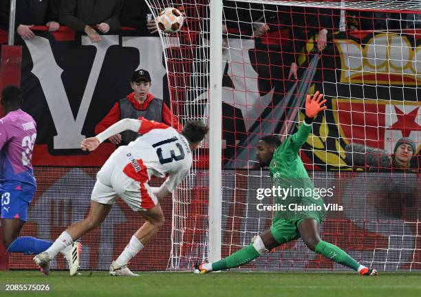 Mike Maignan of AC Milan in action during the UEFA Europa League 2023/24 round of 16 second leg match between Slavia Praha and AC Milan at Eden Arena...