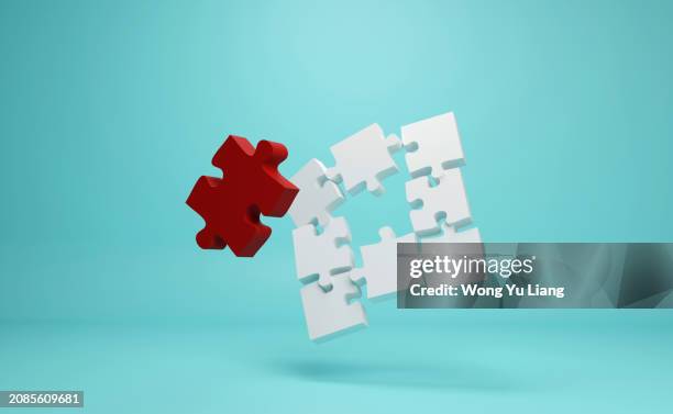 the chosen red jigsaw puzzle concept - pièce de puzzle photos et images de collection