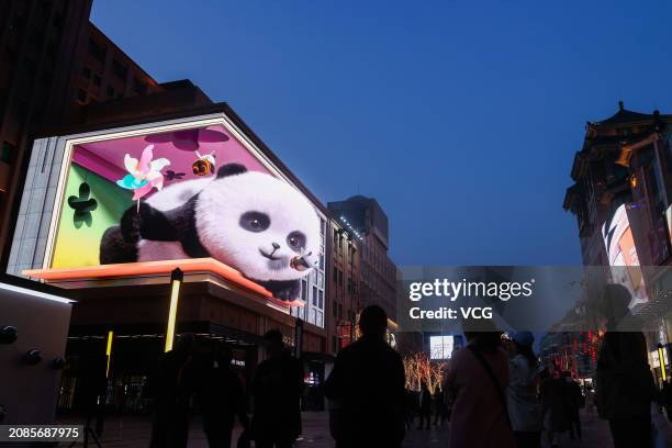 Naked-eye 3D giant panda appears on an outdoor screen at Wangfujing Street on March 14, 2024 in Beijing, China.