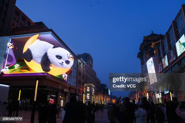 Naked-eye 3D giant panda appears on an outdoor screen at Wangfujing Street on March 14, 2024 in Beijing, China.