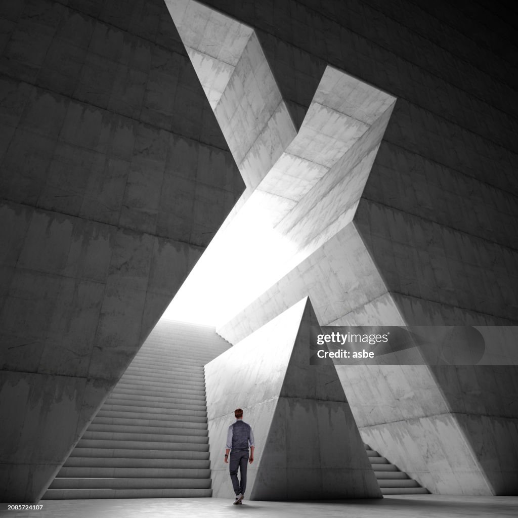 A Man Entering a Hall with Stairs Through X Shaped Gate