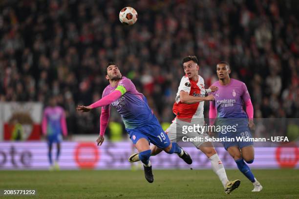 Theo Hernandez of AC Milan and Michal Tomic of Slavia Praha compete for the ball during the UEFA Europa League 2023/24 round of 16 second leg match...