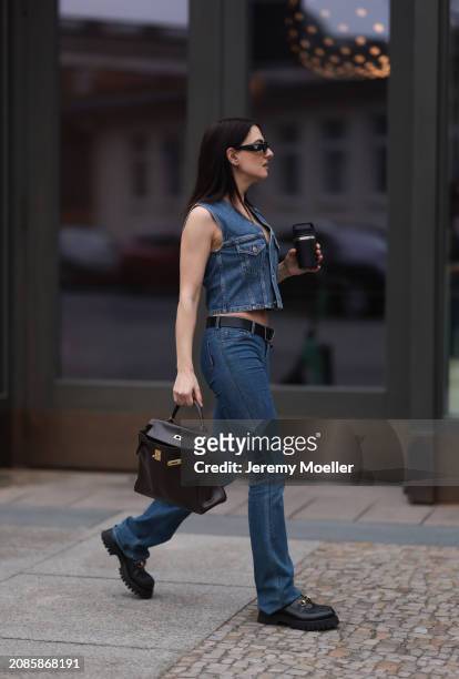 Anna Winter seen wearing Gucci black loafer with golden details, Filipa K denim blue jeans vest, matching Rotate denim jeans pants, Hermes brown...
