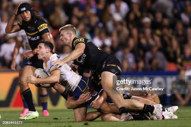 Mitchell Moses of the Eels is tackled during the round two NRL match between Penrith Panthers and Parramatta Eels at BlueBet Stadium, on March 15 in...