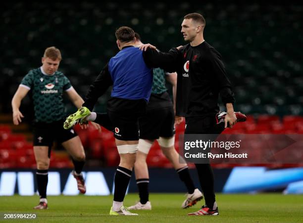 George North of Wales warms up with teammates Taine Basham during the Wales Captain's Run, prior to the Guinness Six Nations Round Five match between...