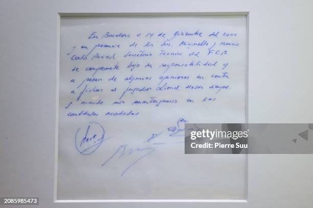 The napkin on which the first promise of a contract was written to secure the 13-year-old Lionel Messi for FC Barcelona is seen at Bonhams auction...