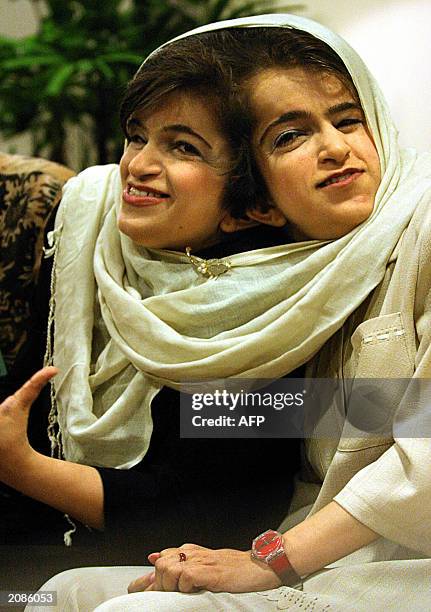 Iranian twins Ladan and Laleh Bijani give a press conference at Raffles Hospital in Singapore, 11 June 2003. Displaying a defiant optimism, the...