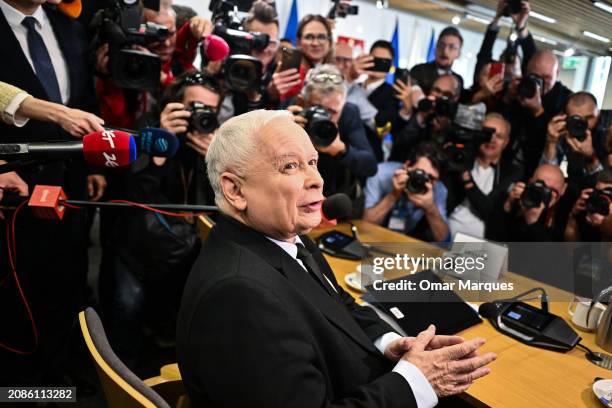 Jaroslaw Kaczynski, leader of the Law and Justice political party , speaks to a member of the press as he prepares to face questions by a government...