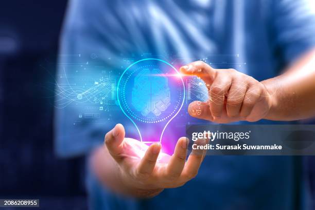 innovation. new concept ideas with innovations hand in hand with future lamp technology and inspiration in science and communication concepts. - new product development innovation stock pictures, royalty-free photos & images