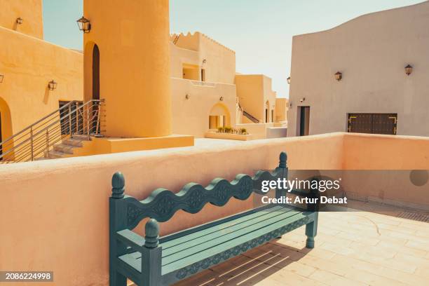 the colorful architecture with arab style in the mina district of doha. - harbor east stock pictures, royalty-free photos & images