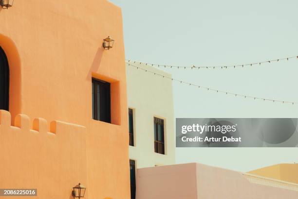 the colorful architecture with arab style in the mina district of doha. - harbor east stock pictures, royalty-free photos & images