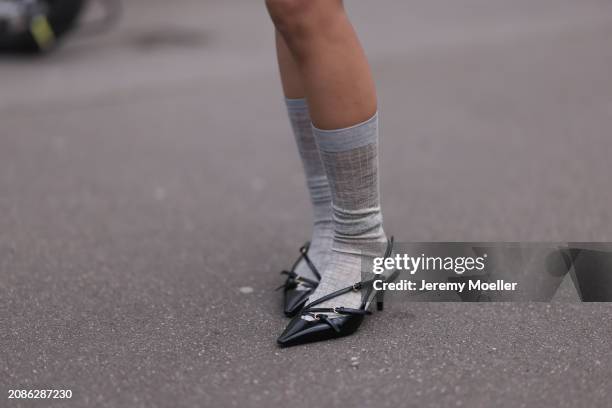 Pernille Teisbaek seen wearing black leather pointy heels shoes and grey socks outside Miu Miu Show during the Womenswear Fall/Winter 2024/2025 as...