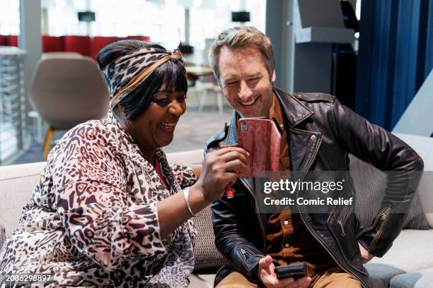 In this image released on March 15 Rustie Lee and Chesney Hawkes during the W1A Lenny Replacement Sketch to be shown during the Red Nose Day 2024...