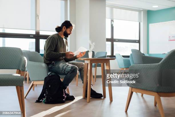 reading in waiting room - emotional series stock pictures, royalty-free photos & images
