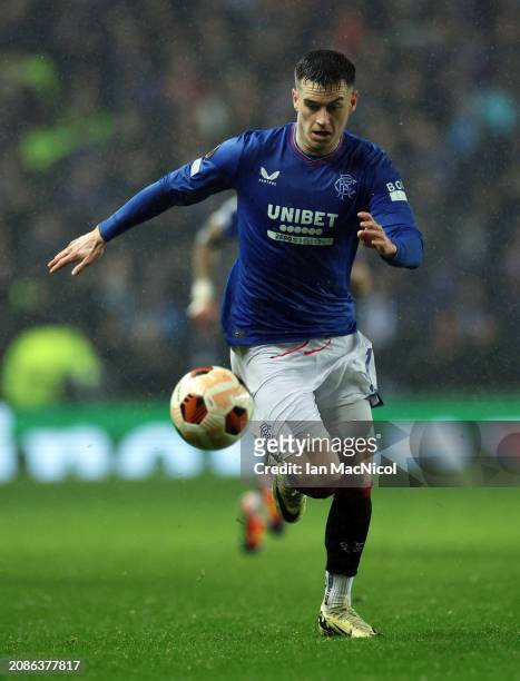 Tom Lawrence of Rangers controls the ball during the UEFA Europa League 2023/24 round of 16 second leg match between Rangers FC and SL Benfica at...