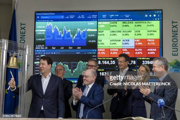 Lotus Bakeries CEO Jan Boone starts ringing the bell during the bell ceremony of the Euronext Brussels Stock Exchange in Brussels on March 18, 2024....