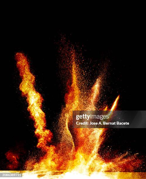 multiple upward explosions per impact of smoke and fire upon impact on a black background. - detonator stock pictures, royalty-free photos & images