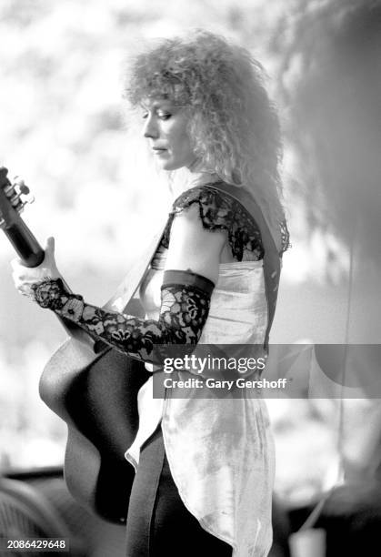 American Rock musician Nancy Wilson, of the group Heart, plays an Ovation guitar as she performs onstage, during the 'Bebe Le Strange' tour, at...