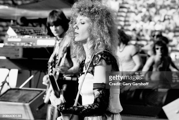 American Rock musician Nancy Wilson, of the group Heart, plays electric guitar as she performs onstage, during the 'Bebe Le Strange' tour, at Giants...