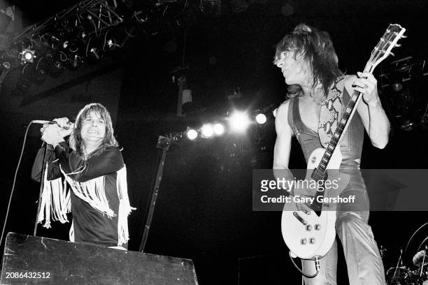 View of British Heavy Metal vocalist Ozzy Osbourne and American musician Randy Rhoads , on electric guitar, as they perform onstage, during the...