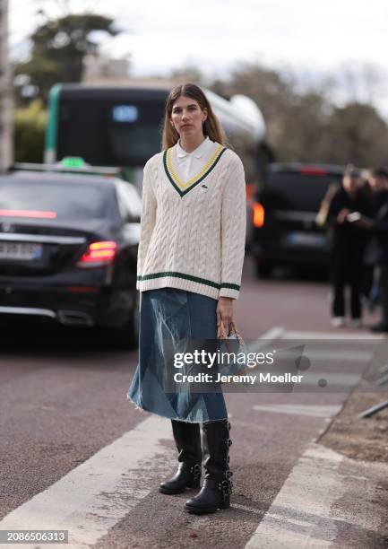 Veronika Heilbrunner seen wearing cream and black Lacoste sweater, white shirt, blue denim jeans skirt and black boots with tan and light blue bag...