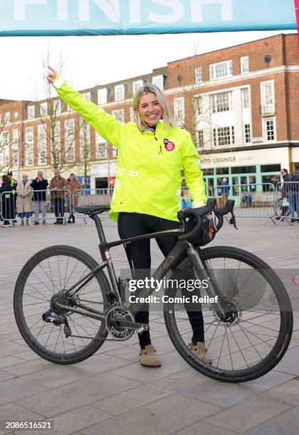 Singer and Radio DJ, Mollie King poses at the finish line after completing the fifth and final day of her 500km cycle challenge across England to...