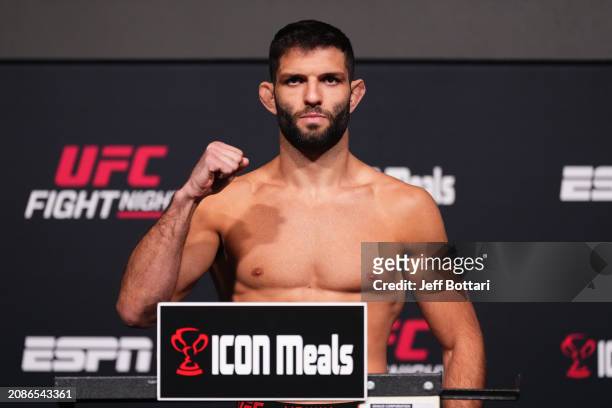 Thiago Moises of Brazil poses on the scale during the UFC Fight Night weigh-in at UFC APEX on March 15, 2024 in Las Vegas, Nevada.
