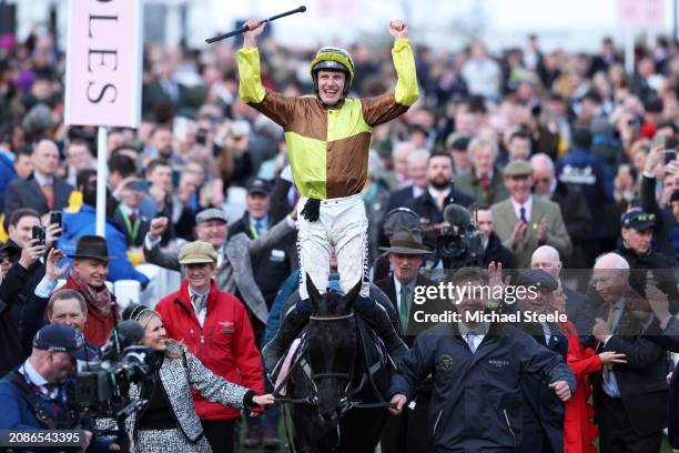 Paul Townend celebrates on board Galopin Des Champs after winning the Boodles Cheltenham Gold Cup Chase during day four of the Cheltenham Festival...