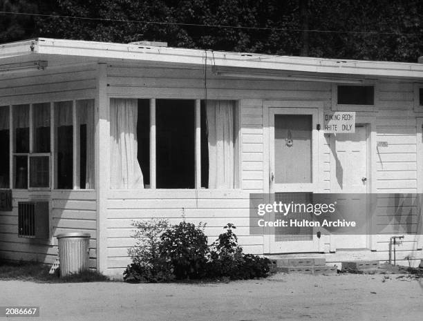 Example of racial discrimination, "Dining Room White Only" sign posted outside a restaurant, circa 1955.