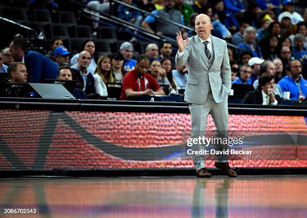 Head coach Mick Cronin of the UCLA Bruins calls to his team in the second half of a quarterfinal game against the Oregon Ducks of the Pac-12...