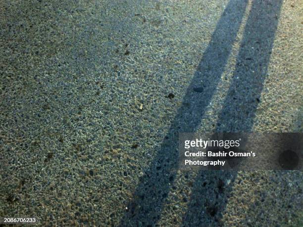 shadows on road - bituminous coal stock pictures, royalty-free photos & images