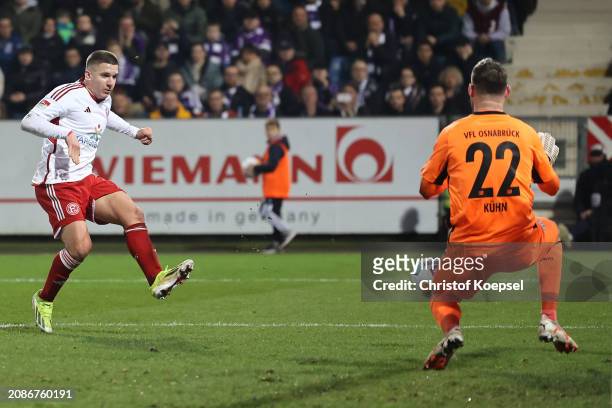Christos Tzolis of Düsseldorf scores a goal 1 against Philipp Kuehn of Osnabrueck during the Second Bundesliga match between VfL Osnabrück and...