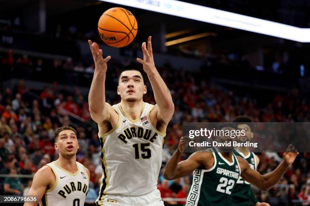 Zach Edey of the Purdue Boilermakers rebounds the ball against the Michigan State Spartans in the second half at Target Center in the Quarterfinals...