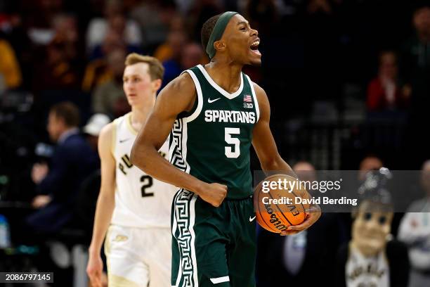 Tre Holloman of the Michigan State Spartans celebrates against the Purdue Boilermakers in the second half at Target Center in the Quarterfinals of...