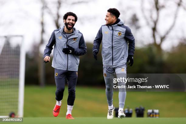 Rayan Ait-Nouri and Joao Gomes of Wolverhampton Wanderers walk out ahead of a Wolverhampton Wanderers Training Session at The Sir Jack Hayward...