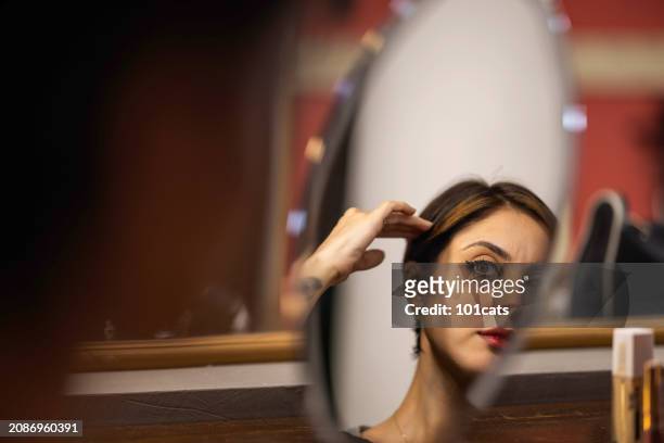 young dancer/actress putting on makeup backstage to perform - 101cats stock pictures, royalty-free photos & images