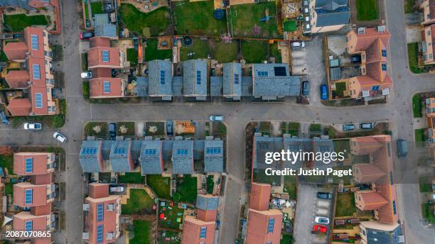 drone view of a newly built residential district in the uk - cambridge uk aerial stock pictures, royalty-free photos & images