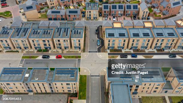 drone view of a newly built residential district in cambridge, uk - cambridge uk aerial stock pictures, royalty-free photos & images
