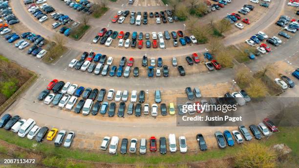 drone/aerial view of 'park and ride' car parking on the edge of cambridge, uk - cambridge uk aerial stock pictures, royalty-free photos & images