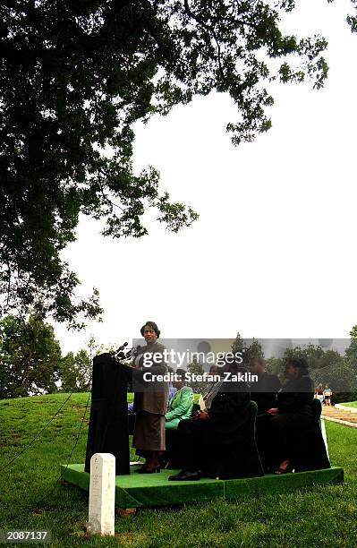 Myrlie Evers-Williams, widow of slain civil rights leader Medgar Evers, speaks at her husband's gravesite in Arlington National Cemetery June 16,...