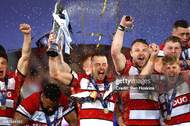 Lewis Ludlow of Gloucester lifts the Premiership Rugby Cup trophy following the final of the Premiership Rugby Cup between Gloucester Rugby and...