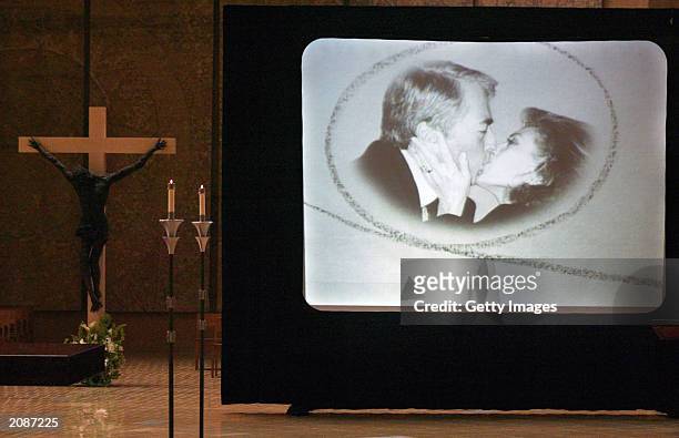 The video presentation is concluded with Peck kissing his wife, Veronique at the memorial mass for actor Gregory Peck at the Cathedral of Our Lady of...
