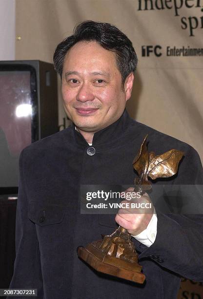 Oscar nominated director Ang Lee holds his trophy at the 16th Annual IFP/WEST Independent Spirit Awards 24 March 2001 in Santa Monica, CA. Lee won...