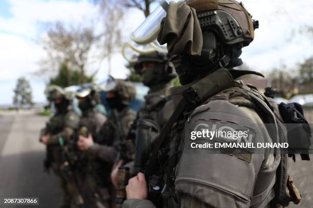 Members of the elite tactical unit of the gendarmerie GIGN are seen during a demonstration of the security system during the Olympic flame's journey,...