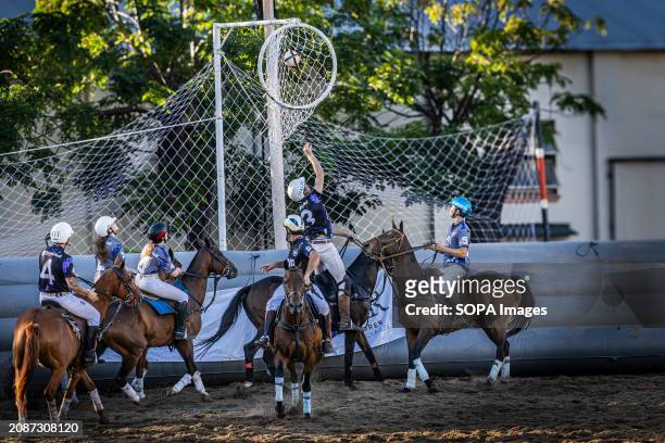 Spain's Gil Carbones of the Cavalier team scores a goal during the Open Horseball Argentina, held at the Regimiento de Granaderos a Caballo. Final...