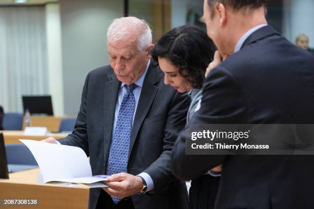 Commissioner for Foreign Affairs and Security Policy - Vice President Josep Borrell shows a report to the Belgium Minister of Foreign, European...